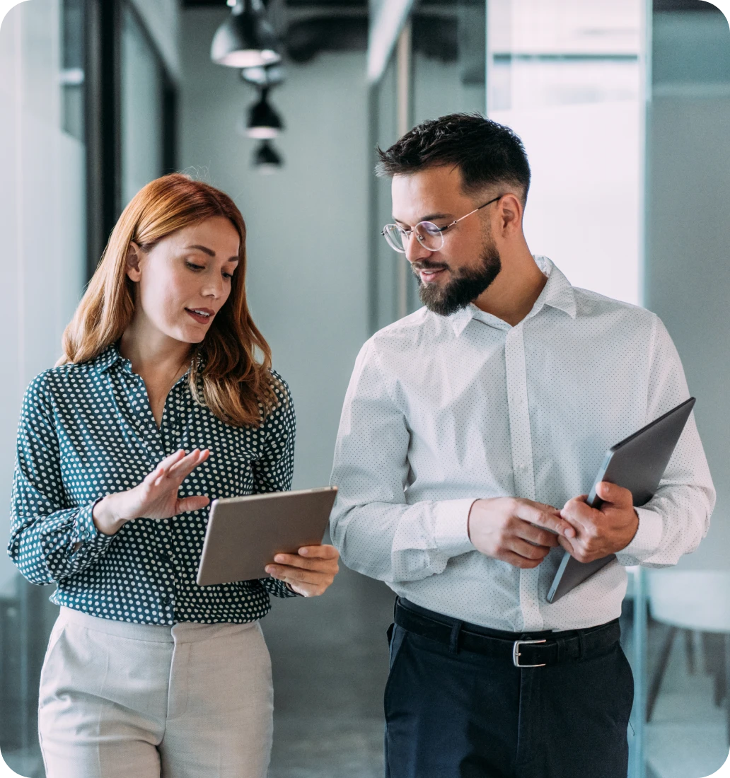 Business meeting between coworkers with technology
