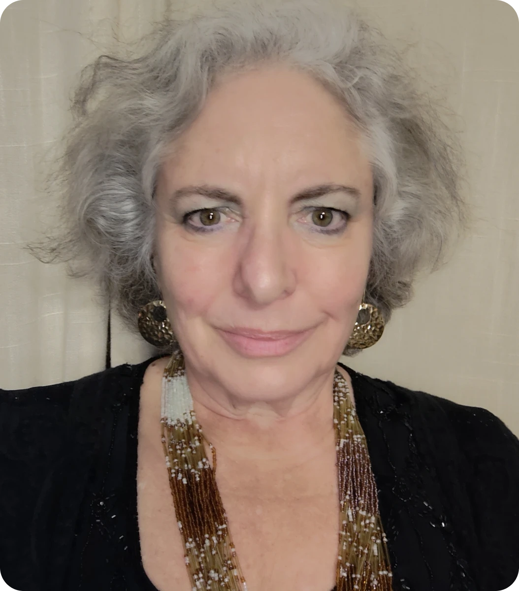 Woman wearing earrings and smiling gently