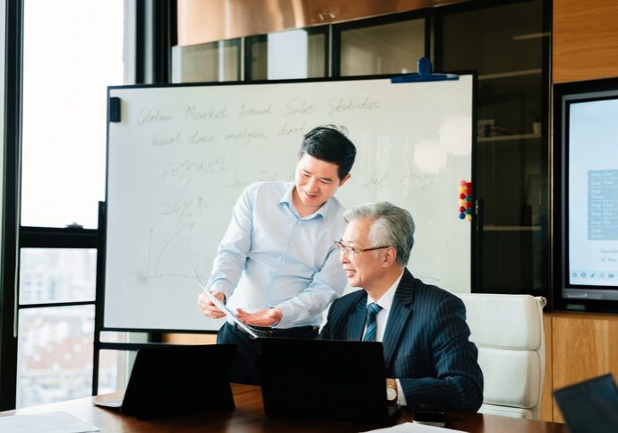 Two men reviewing documents together